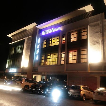 Hotin Inn Kuching Bagian luar foto