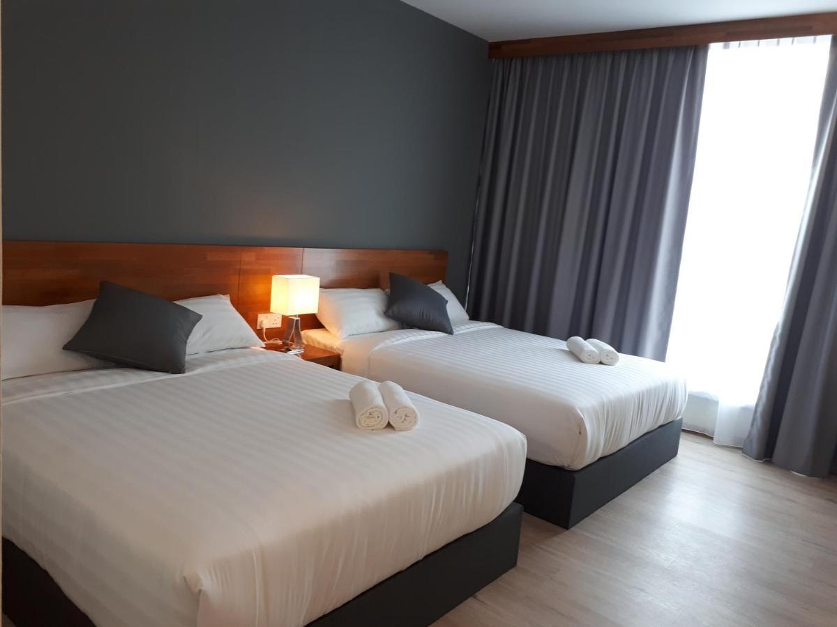 Hotin Inn Kuching Bagian luar foto