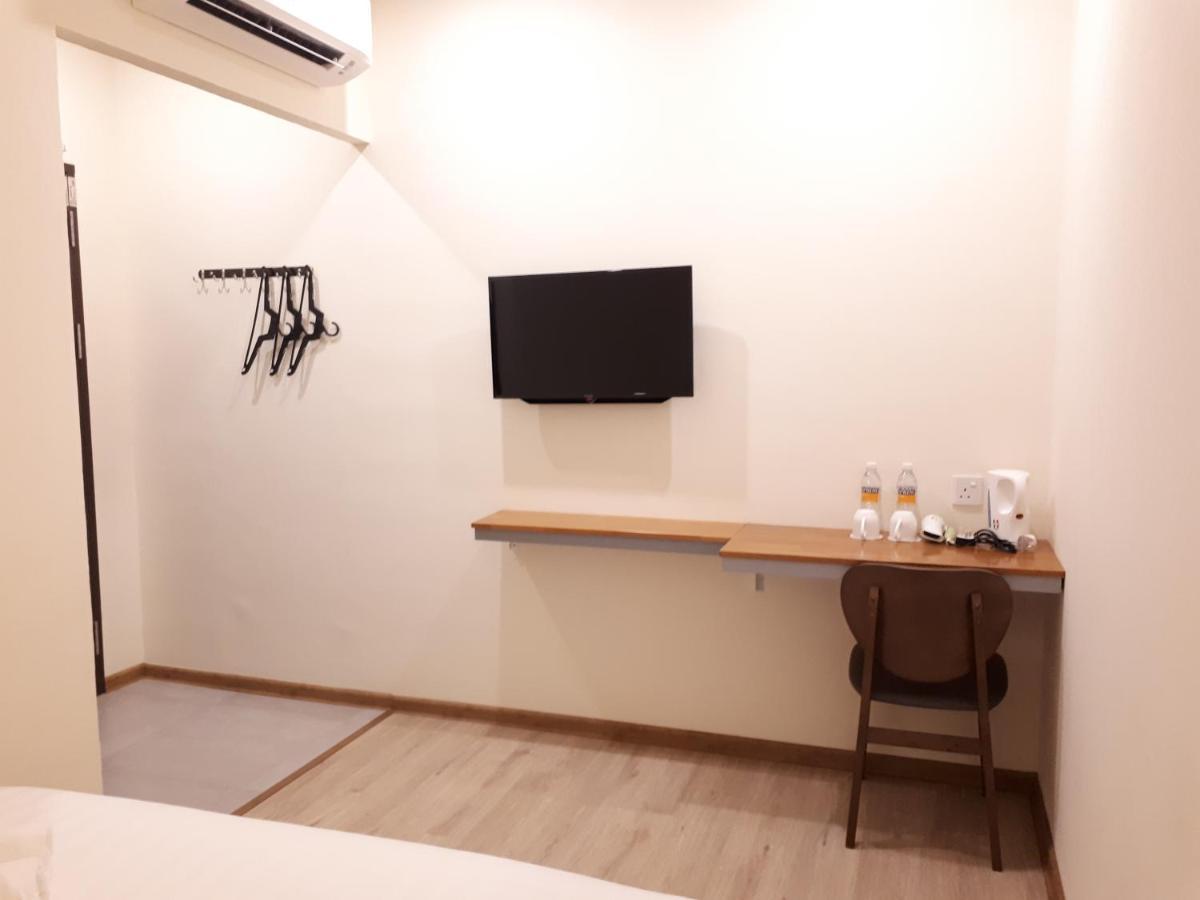 Hotin Inn Kuching Bagian luar foto