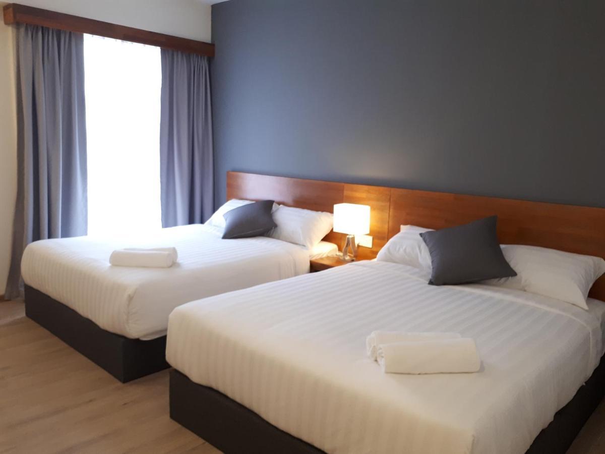 Hotin Inn Kuching Bagian luar foto