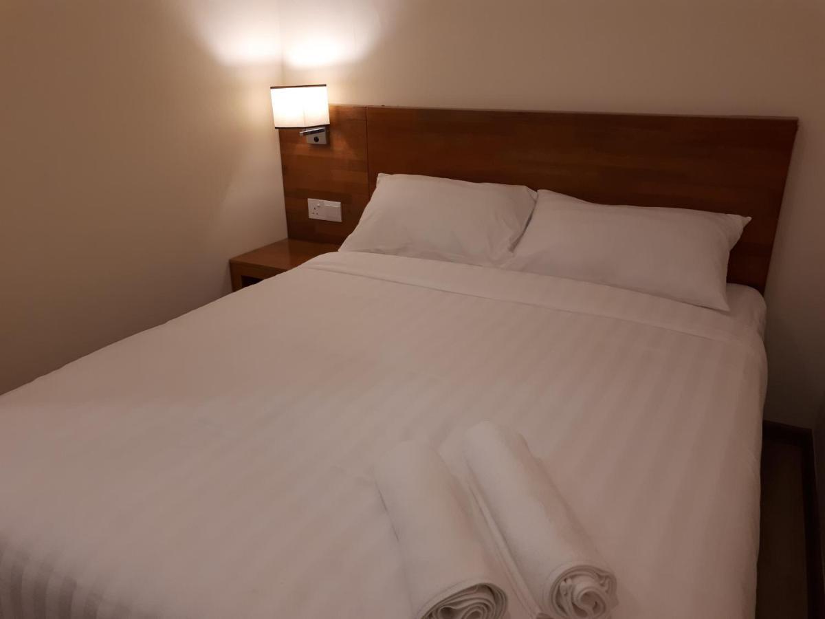 Hotin Inn Kuching Bagian luar foto