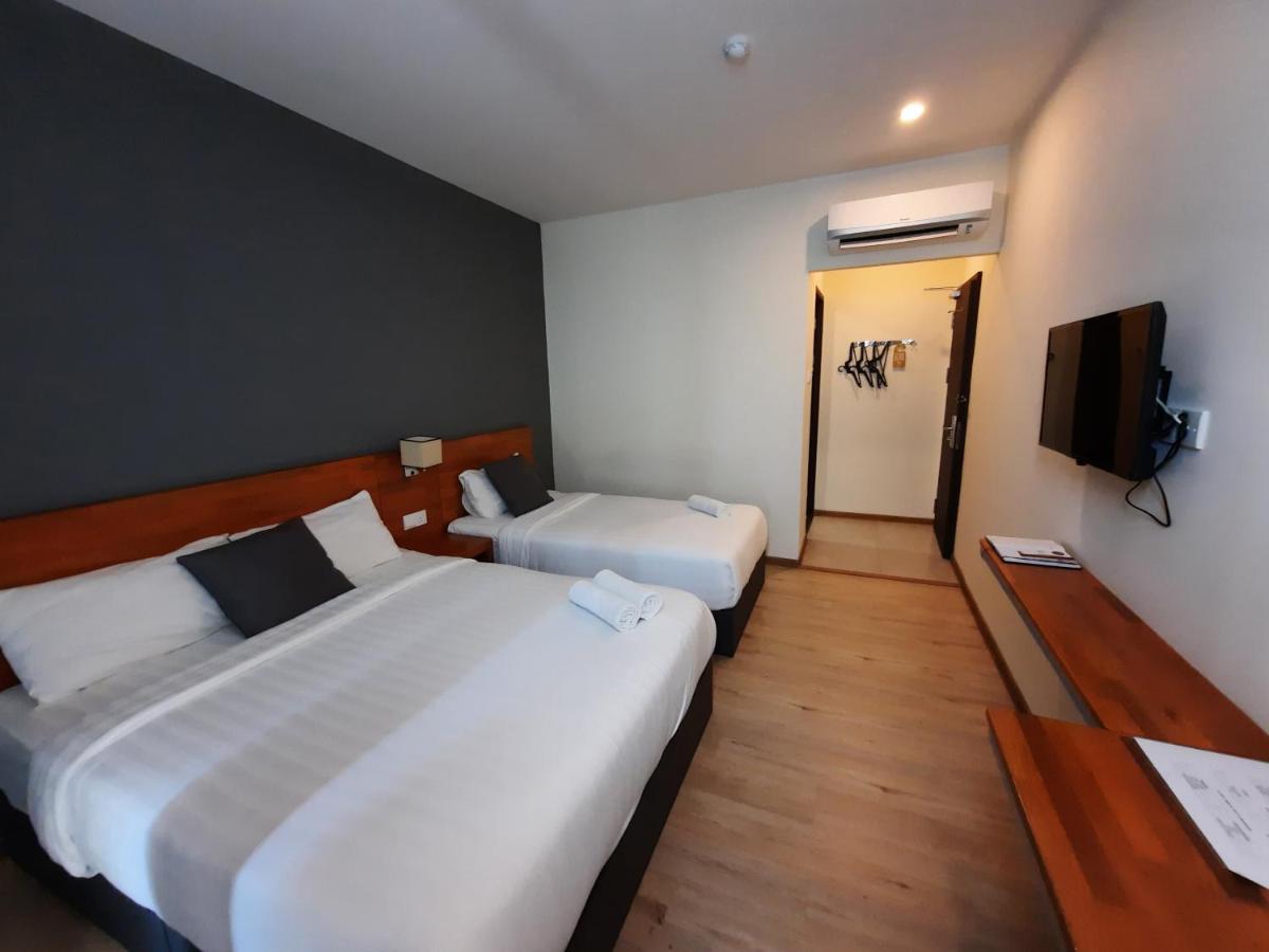 Hotin Inn Kuching Bagian luar foto
